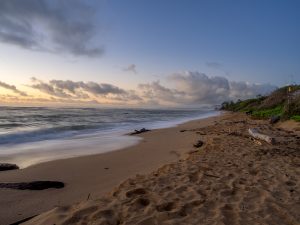 Sunrise on eastern shore of Kauai in Lydgate State park.