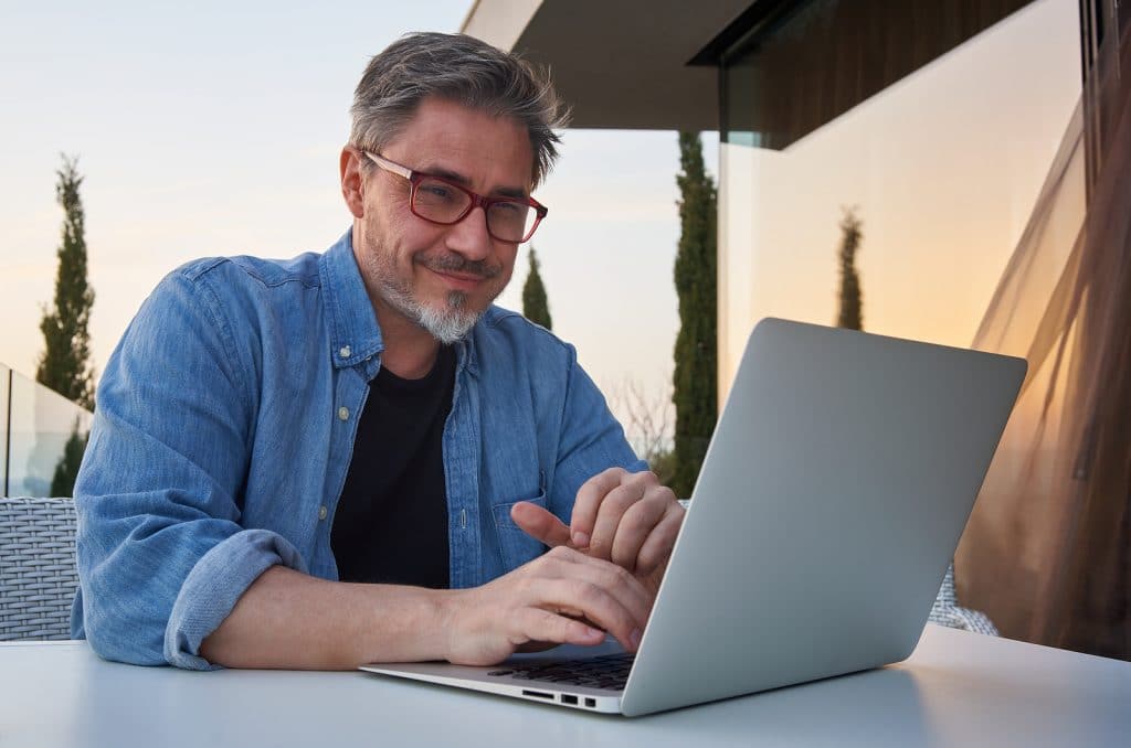 Man working online with laptop