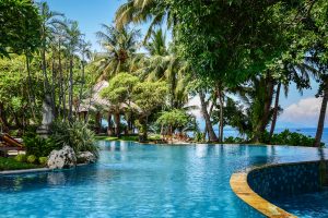 Luxury hotel "Puri Bagus Lovina Villa Resort & Spa" territory with swimming pool on Bali island, Indonesia