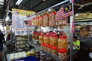 Georgetown, Penang, Malaysia, January 4, 2020: Packaging of produce at a stall at Pasar Lebuh Cecil Market in Georgetown, Malaysia.