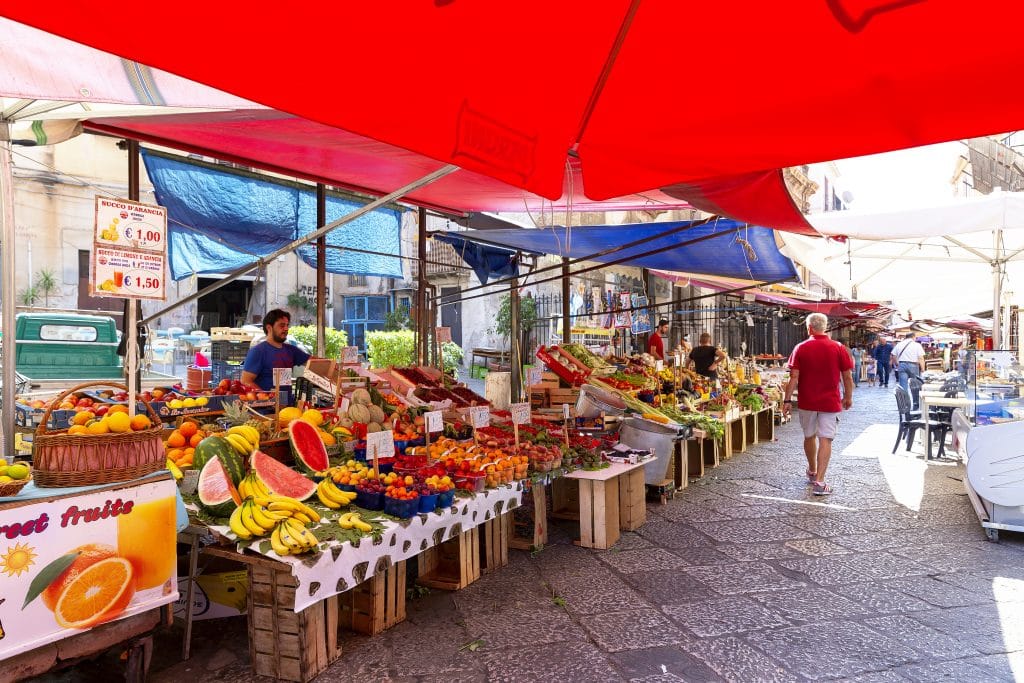 PALERMO, SICILY, June 27, 2019: Il Capo market in Palermo, Sicily. Variegated market stalls. This is one of several popular street markets in Palermo.