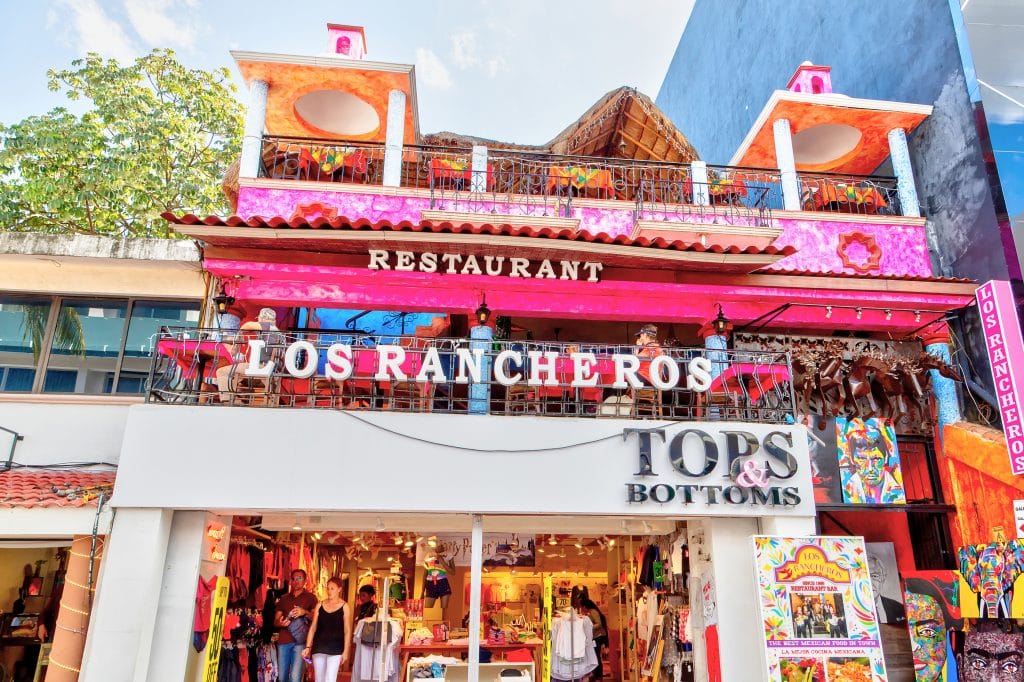PLAYA DEL CARMEN, MEXICO - Dec. 26, 2019: Visitors enjoy shopping and dining on famous 5th Avenue in the entertainment district of Playa del Carmen in the Yucatan peninsula of Caribbean Mexico in Cancun.
