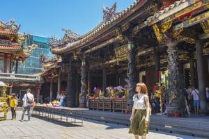Taipei, Taiwan - Aug 7, 2018 : Crowd of people make a pray at Longshan Temple in Taipei, Taiwan on August 7, 2018.