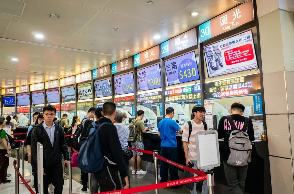 Taipei, Taiwan - Jun 6th, 2019: people with Taipei long distance bus station building at Taipei, Taiwan