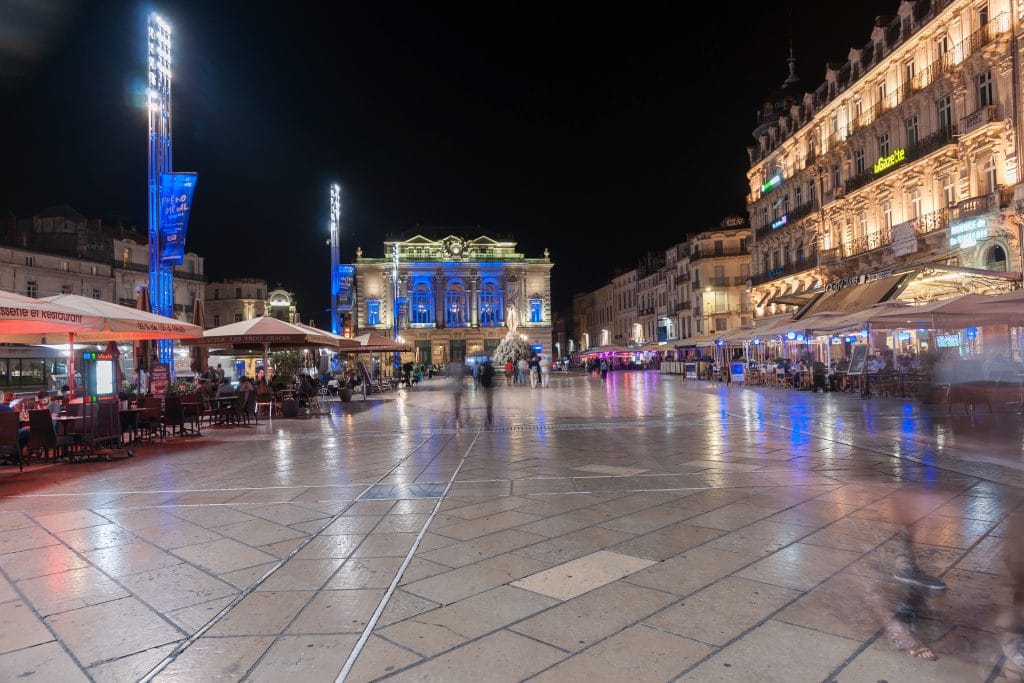 September 29, 2016, Night in the Place de la Comédie wonderful architecture and Three Graces fountain on promenade under night lights and long exposure Place de la Comédie Montpellier France urban & architectural