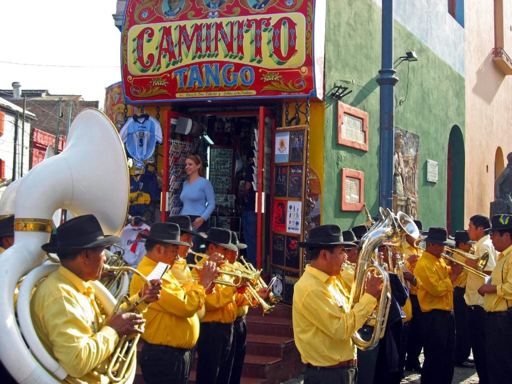 BUENOS AIRES ARGENTINA - October 12: A street band plays in the La Boca district of Buenos Aires Argentina Oct 12 2006.