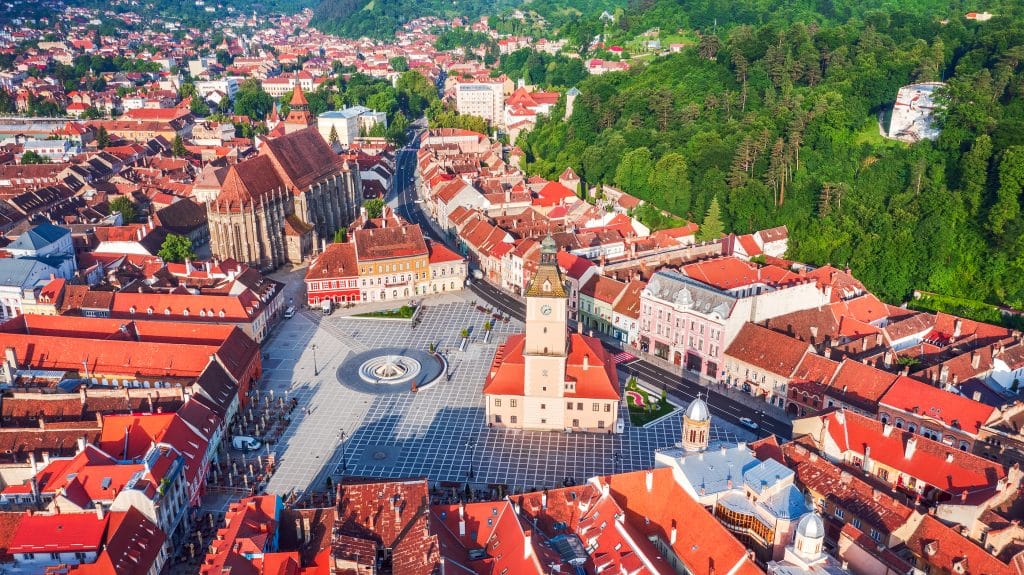 Brasov, Romania - Aerial drone view of Council Square with Black Church, medieval downtown, Transylvania.