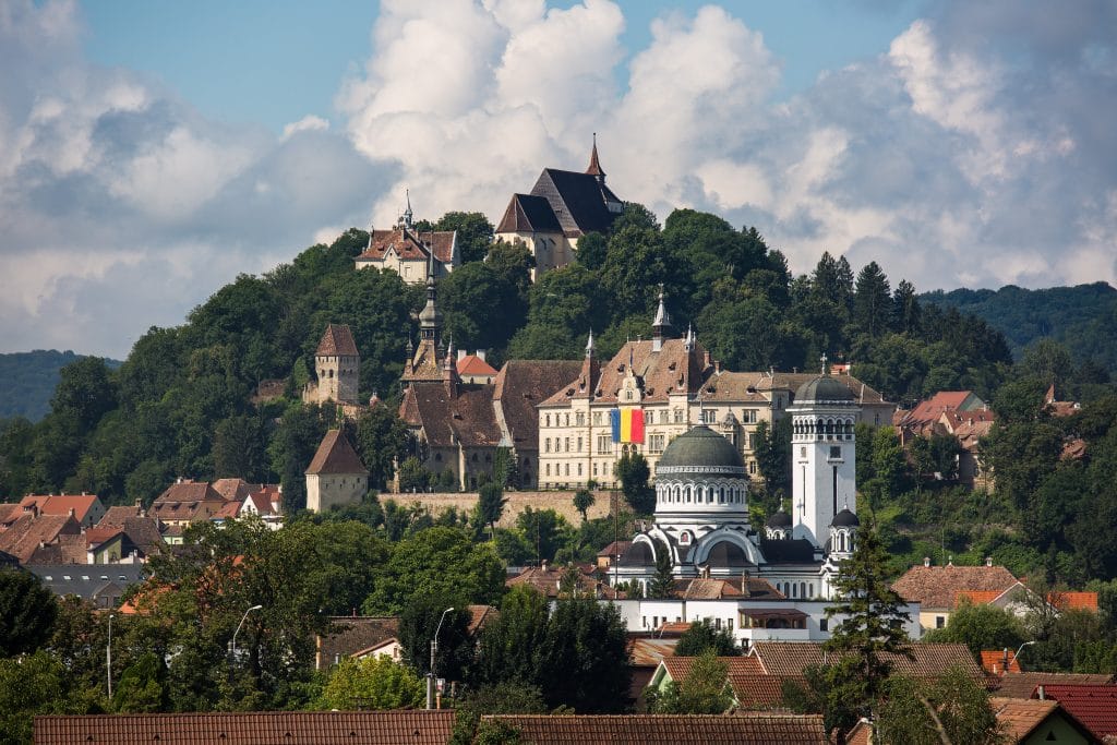 Brasov, Romania-June 14 2018 :Aerial view on red tiled roofs of medieval Brasov town in Transylvania, Romania. Europe