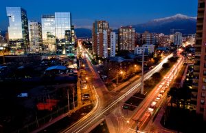 Busy traffic in Santiago, Chile with the Andes in the background