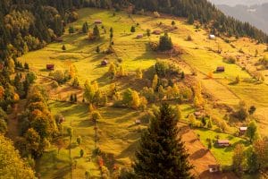 Moieciu de Sus, Brasov county, Romania. Rural autumn landscape in the Carpathian Mountains