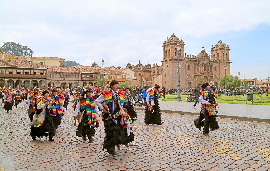 Peruvian Parade of Participants in Beautiful Rainbow Outfits (Color of Cusco City Official Flag), Held on May 6th, 2018 on Plaza de Armas, Cusco, Peru, South America