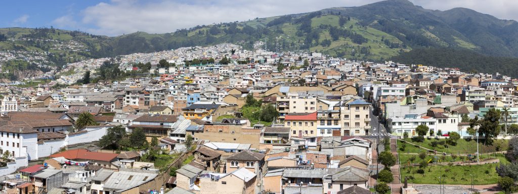 QUITO, ECUADOR, FEBRUARY 24: Panorama of Quito with residential colonial houses in the mountain during the day with a blue sky. Ecuador 2015.