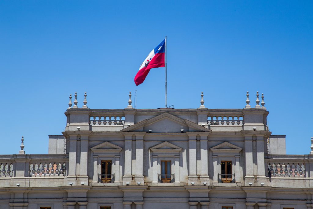 Santiago de Chile, Chile - November 26, 2015: Chilean national flag on top of Palacio de la Moneda, te seat of the president.