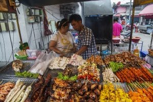 KO PHA NGAN, THAILAND - FEBRUARY 7, 2016: Unidentified sellers of thai food. Street food is a quintessential part of the Thai experience.