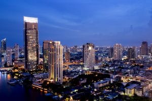 Bangkok THAILAND - July 11 2020 : View landscape of Bangkok tower with river in the evening, downtown and cityscape in twilight at Thailand, skyscraper and condominium.