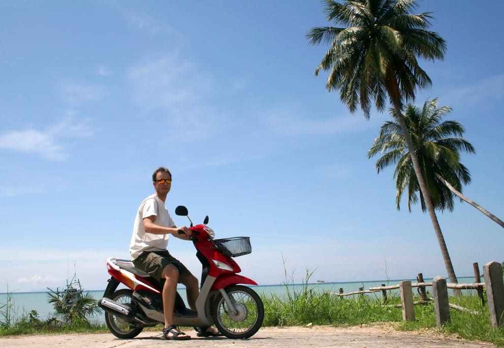 touring the island of ko pha-ngan by moped.