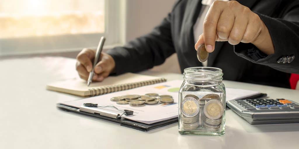 Working men aged 25-60, put coins in a glass jar to save money