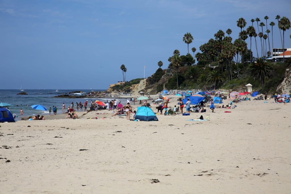 Laguna Beach, California / USA - August 23, 2020: People enjoy the beach in Laguna Beach California during the Coronavirus Pandemic. Editorial Use Only