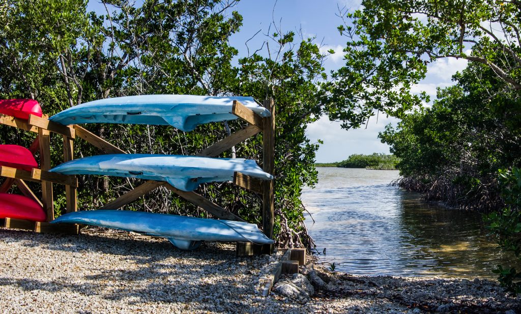 Florida Keys Canoe Launch: Rental Canoes And Kayaks Wait Beside