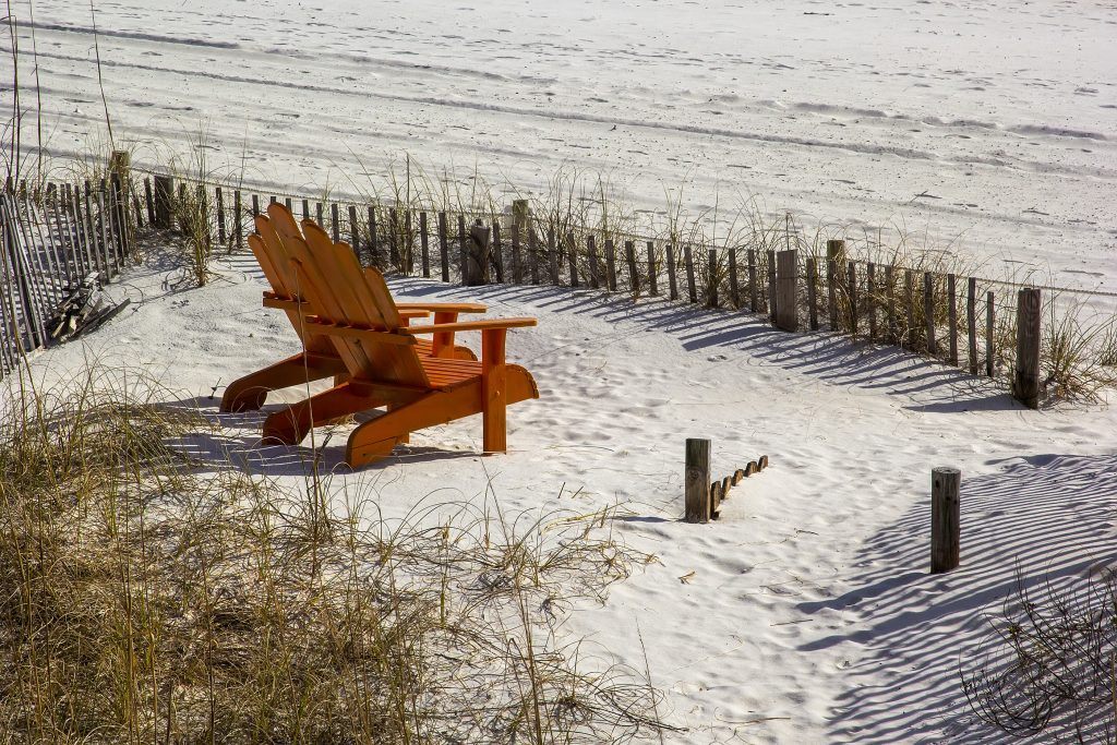 Pair Of Orange Adirondack Leisure Chairs On The Beach In Destin,