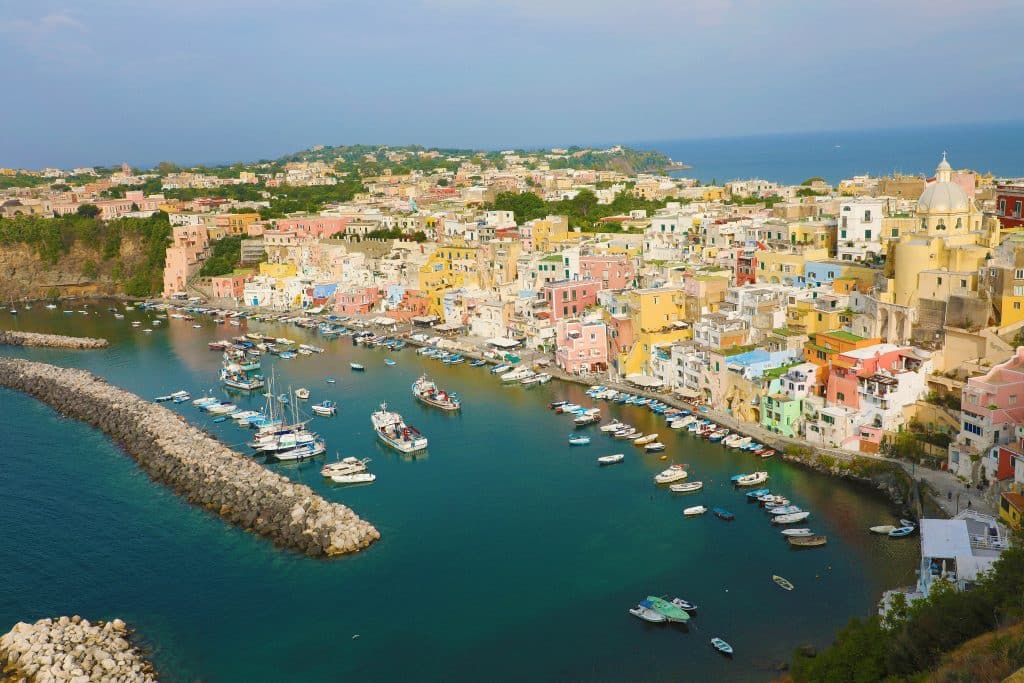 Panoramic View Of Beautiful Procida In Sunny Summer Day. Colorfu
