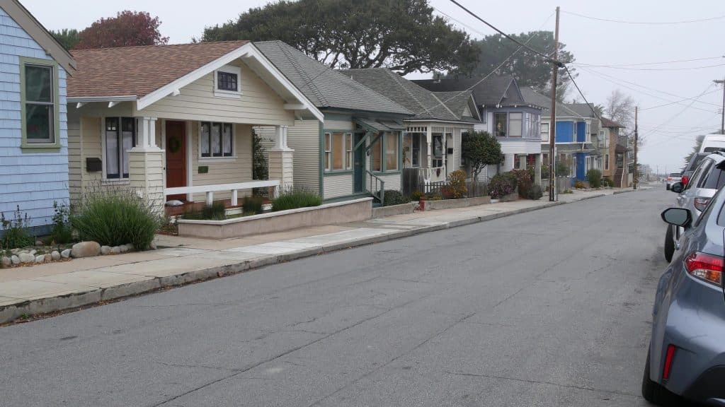 Row of old victorian style houses, historic residential district, Monterey, California USA. Colonial architecture, retro vintage suburban wooden classical cottages. Real estate property, city street.