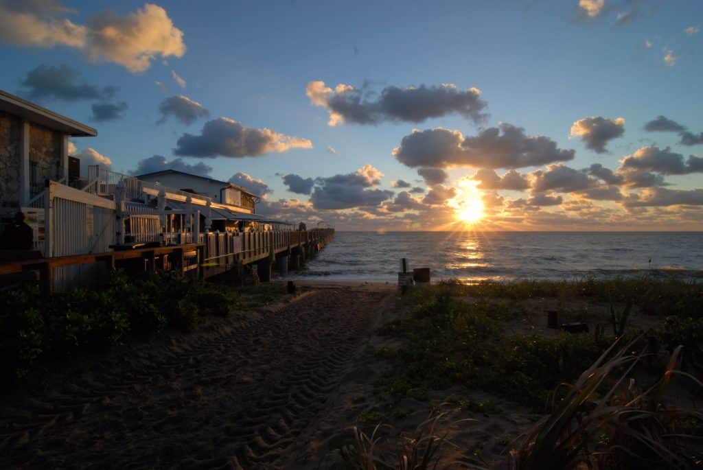 The Lake Worth Pier And Beach At Sunrise In Lake Worth, Florida
