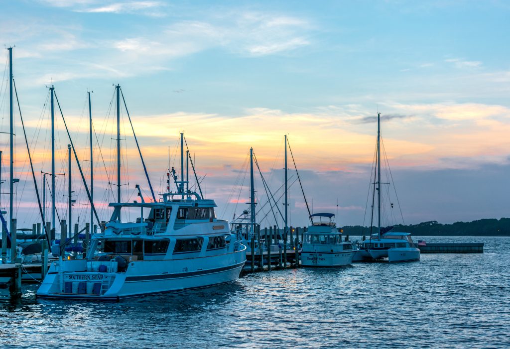 Panama City Beach, Florida, USA - July 11, 2015: Boats at the Panama City Marina docked at sunset.
