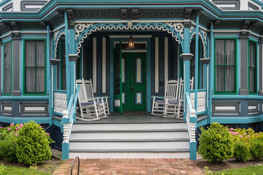 Cape May, NJ - 12 June 2019: Entrance to Victorian painted wooden homes in the historic downtown area of the city
