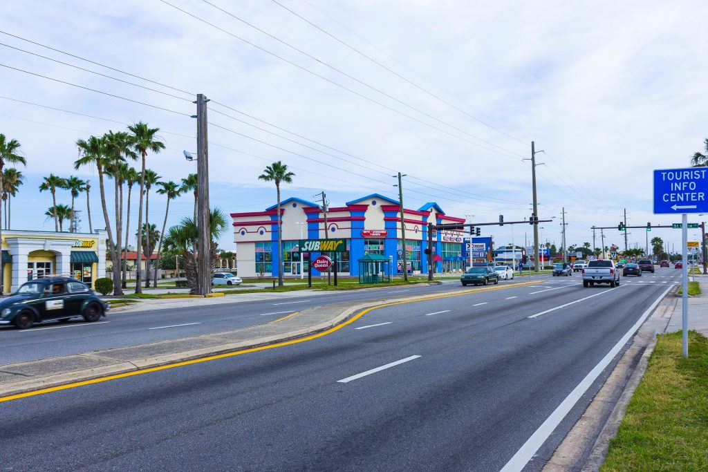 Cocoa beach, Florida, USA - April 29, 2018: The central road with shops, restaurants and hotels at Cocoa beach, Florida, USA on April 29, 2018